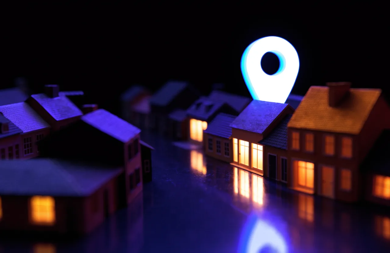 Local SEO for Central Kentucky: a glowing map pin over a small town of lit houses at night